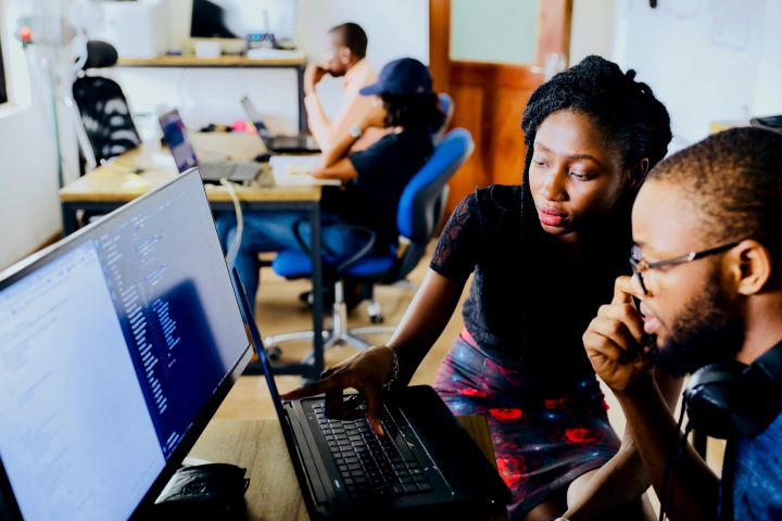 black woman conducting research at a computer