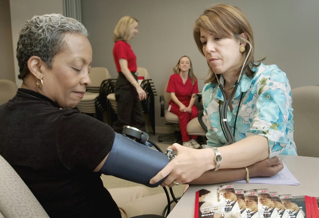 black woman having her blood pressure taken